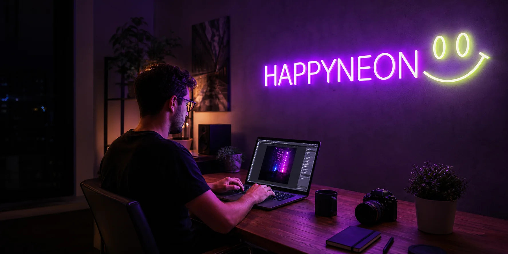 En skaper som arbeider med et glødende neonskilt.