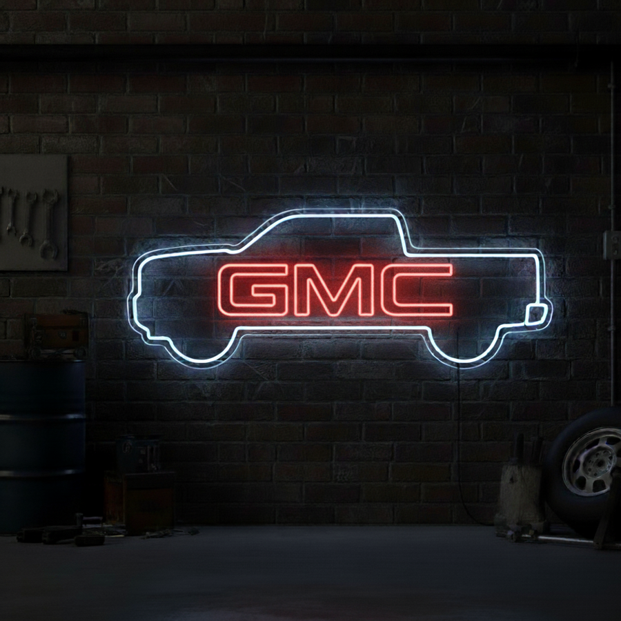 Neon sign in the shape of a pickup truck outline with “GMC” text, perfect for garages and car enthusiasts.